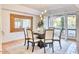 Elegant dining room with a round table, six chairs, and natural light at 3117 E Sierra Madre Way, Phoenix, AZ 85016