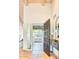 Inviting entryway with wood-beamed ceiling and dark wood door at 3117 E Sierra Madre Way, Phoenix, AZ 85016