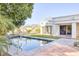 Relaxing pool area with grassy lawn and tiled patio at 3117 E Sierra Madre Way, Phoenix, AZ 85016