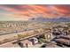 Aerial view of a house near a highway with mountain views at 3234 S Bowman Rd, Apache Junction, AZ 85119