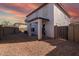 Spacious backyard with gravel and covered patio at 3234 S Bowman Rd, Apache Junction, AZ 85119