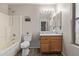 Clean bathroom with wood vanity, tub, and vinyl flooring at 3234 S Bowman Rd, Apache Junction, AZ 85119