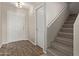 Entryway with staircase, wood-look flooring, and white doors at 3234 S Bowman Rd, Apache Junction, AZ 85119