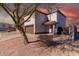 Two-story house with brown garage door and landscaping, desert landscape in the background at 3234 S Bowman Rd, Apache Junction, AZ 85119