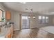 Bright kitchen with wood cabinets, stainless steel appliances, and vinyl flooring at 3234 S Bowman Rd, Apache Junction, AZ 85119