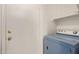 Bright laundry room with washer, dryer, and storage shelf at 3234 S Bowman Rd, Apache Junction, AZ 85119