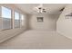 Spacious living room with carpeted floors and ceiling fan at 3234 S Bowman Rd, Apache Junction, AZ 85119