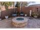 Relaxing backyard patio with fire pit and seating area, perfect for outdoor entertaining at 337 W Stanley Ave, San Tan Valley, AZ 85140