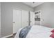 Bedroom with double door closet and neutral decor at 337 W Stanley Ave, San Tan Valley, AZ 85140