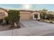 Single-story home with a two-car garage and well-manicured landscaping at 337 W Stanley Ave, San Tan Valley, AZ 85140