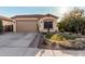 Single-story home with a two-car garage and nicely landscaped front yard at 337 W Stanley Ave, San Tan Valley, AZ 85140