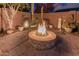 Stone fire pit perfect for evenings in the backyard at 337 W Stanley Ave, San Tan Valley, AZ 85140