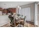 Kitchen features a dining area, wood cabinets, and an island at 337 W Stanley Ave, San Tan Valley, AZ 85140