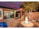 Covered patio with fire pit, perfect for outdoor entertaining at 337 W Stanley Ave, San Tan Valley, AZ 85140