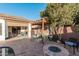 Relaxing patio with fire pit and pergola for shade at 337 W Stanley Ave, San Tan Valley, AZ 85140