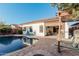 Large kidney shaped pool with surrounding patio and pergola at 337 W Stanley Ave, San Tan Valley, AZ 85140