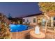 Relaxing backyard with a refreshing pool and fire pit for cool nights at 337 W Stanley Ave, San Tan Valley, AZ 85140