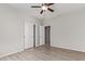 Bedroom with tile floors, ceiling fan and double door closet at 34909 N Palm Dr, San Tan Valley, AZ 85140