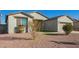 Single-story house with a two-car garage and landscaped front yard at 34909 N Palm Dr, San Tan Valley, AZ 85140