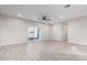 Bright living room featuring tile floors and a ceiling fan at 34909 N Palm Dr, San Tan Valley, AZ 85140