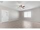 Bright living room featuring tile floors and a ceiling fan at 34909 N Palm Dr, San Tan Valley, AZ 85140