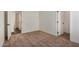 Bright bedroom with carpet and multiple doors at 36747 W Harrison St, Tonopah, AZ 85354