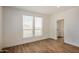 Bright bedroom with wood flooring and walk-in closet at 36747 W Harrison St, Tonopah, AZ 85354