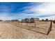 Side view of a single story home with a chain link fence at 36747 W Harrison St, Tonopah, AZ 85354