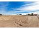 Vacant lot with clear skies and sparse vegetation at 36747 W Harrison St, Tonopah, AZ 85354