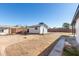 Backyard view with shed and pathways at 3744 W Malapai Dr, Phoenix, AZ 85051