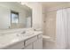 Clean bathroom with white vanity, shower, and tiled floor at 3744 W Malapai Dr, Phoenix, AZ 85051