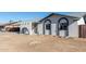 White single story home with arched entryway and landscaping at 3744 W Malapai Dr, Phoenix, AZ 85051