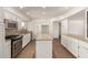 Modern kitchen featuring white cabinets, granite countertops, and a kitchen island at 3744 W Malapai Dr, Phoenix, AZ 85051