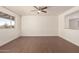 Spacious living room featuring hardwood floors and a ceiling fan at 3744 W Malapai Dr, Phoenix, AZ 85051