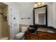 Charming bathroom with cabinet storage, granite countertop, decorative mirror, and shower at 4054 E Clovis Cir, Mesa, AZ 85206
