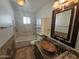 Bathroom with bathtub, double sinks, and granite vanity at 4054 E Clovis Cir, Mesa, AZ 85206