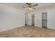 Spacious bedroom with tile flooring, a ceiling fan and large closets at 4054 E Clovis Cir, Mesa, AZ 85206