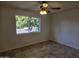 Bedroom with tile flooring and large window at 4054 E Clovis Cir, Mesa, AZ 85206