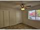 Bright bedroom with tile flooring and double closets at 4054 E Clovis Cir, Mesa, AZ 85206