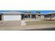 Well-maintained single-Gathering home with attached garage, solar panels, desert landscaping, and updated neutral exterior at 4054 E Clovis Cir, Mesa, AZ 85206