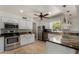Bright kitchen with cabinets, drawers, stainless steel appliances, granite countertops and tile backsplash at 4054 E Clovis Cir, Mesa, AZ 85206