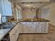 Open kitchen with large island and granite countertops at 4054 E Clovis Cir, Mesa, AZ 85206