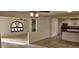 Open concept kitchen and living area with tile floors and a fireplace at 4054 E Clovis Cir, Mesa, AZ 85206