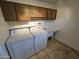 Laundry room with washer, dryer, and utility sink at 4054 E Clovis Cir, Mesa, AZ 85206