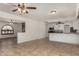Open living room showcasing tile floors and easy access to the kitchen, dining, and living areas at 4054 E Clovis Cir, Mesa, AZ 85206