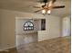 Living room with kitchen access and tile flooring at 4054 E Clovis Cir, Mesa, AZ 85206