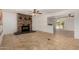 Open-concept living room featuring tile floors, a ceiling fan, and a view into the kitchen at 4054 E Clovis Cir, Mesa, AZ 85206