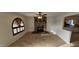 Living room with a stone fireplace and an open concept to the kitchen at 4054 E Clovis Cir, Mesa, AZ 85206