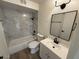 Updated bathroom with marble-look tile and modern vanity at 4062 W Camino Acequia St, Phoenix, AZ 85051