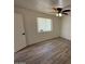 Bright bedroom with ceiling fan and wood-look tile floor at 4062 W Camino Acequia St, Phoenix, AZ 85051